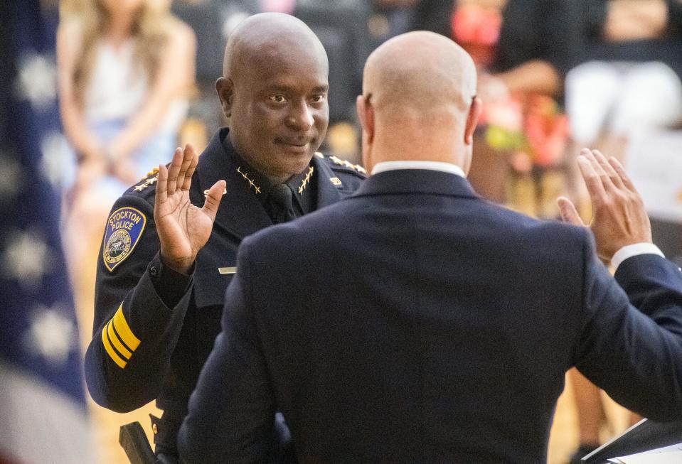 New Stockton Police Chief Stanley McFadden is sworn in by City Manager Harry Black during a ceremony at the Stockton Memorial Civic Auditorium in downtown Stockton on Thursday, June 2, 2022. 