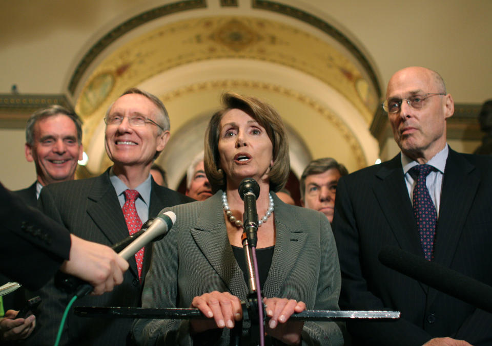 House Speaker Nancy Pelosi, Treasury Secretary Henry Paulson, right, Senate Majority Leader Harry Reid, second from left, and Sen. Judd Gregg, R-N.H., left, announce a tentative deal on legislation regarding the financial crisis on Sept. 28, 2008. (Photo: Lauren Victoria Burke/AP)