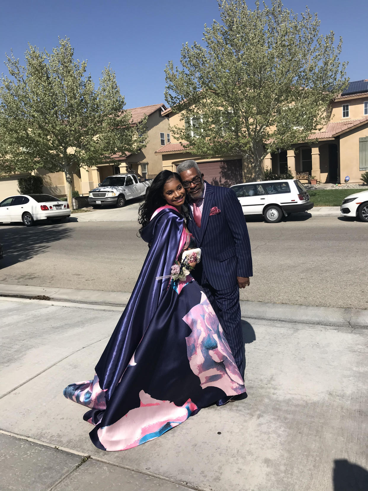 Kaylah Bell poses with her dapper grandpa who stood in as her date when she couldn't find one. (Credit: Kaylah Bell)