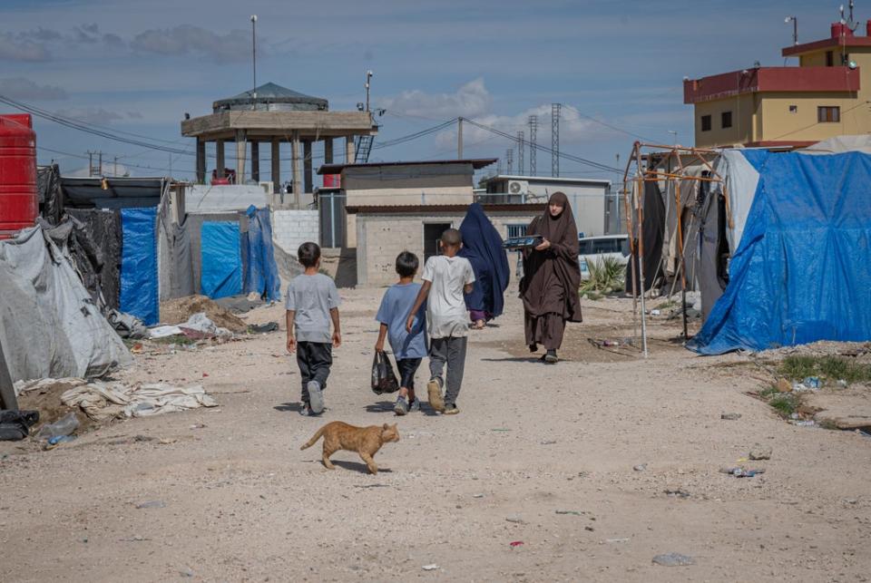 Children walk through Roj camp in northeast Syria (Bel Trew)