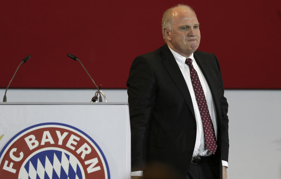 Former FC Bayern Munich president Uli Hoeness leaves the podium after his speech at an extraordinary members meeting, in Munich, southern Germany, Friday, May 2, 2014. The club votes a new president. (AP Photo/Matthias Schrader)