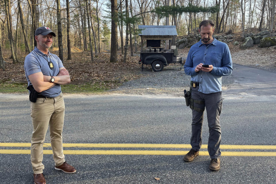 FBI officials guard the driveway where Jack Teixeira, a Massachusetts Air National Guard member, was taken into custody in Dighton, Mass., Thursday, April 13, 2023. Teixeira, 21, was arrested Thursday in connection with the disclosure of highly classified military documents about the Ukraine war and other top national security issues. (AP Photo/Jennifer McDermott)