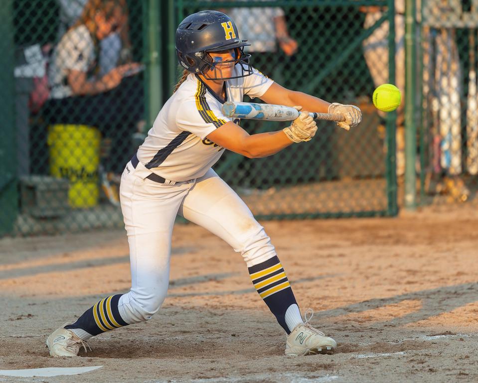 Kate McIntyre drops a bunt to score Hartland's final run in a 3-0 victory over Grosse Pointe North in a state quarterfinal Wednesday, June 14, 2023 at Wayne State University.