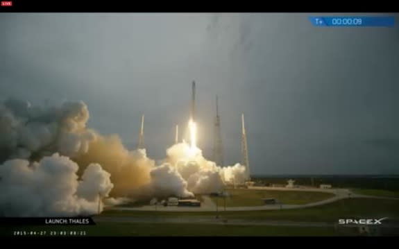 This screenshot from a webcast shows SpaceX's Falcon 9 rocket blasting off on April 27, 2015, carrying the first-ever satellite for the Central Asian nation of Turkmenistan.