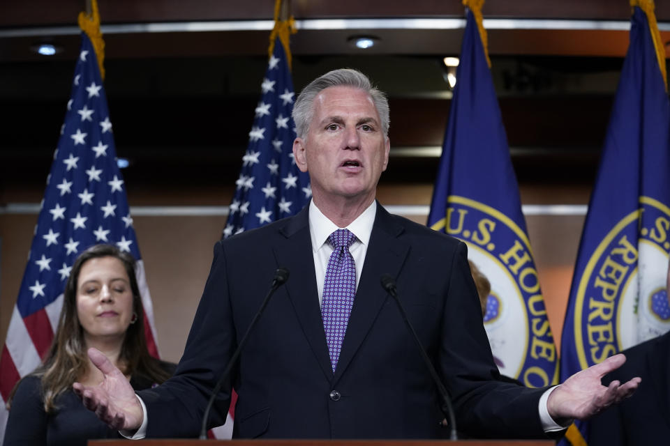 FILE - House Minority Leader Kevin McCarthy, R-Calif., joined by Republican Conference Chair Elise Stefanik, R-N.Y., left, talks to reporters about the appropriations process by the majority Democrats to fund the government, at the Capitol in Washington, Dec. 14, 2022. (AP Photo/J. Scott Applewhite, File)