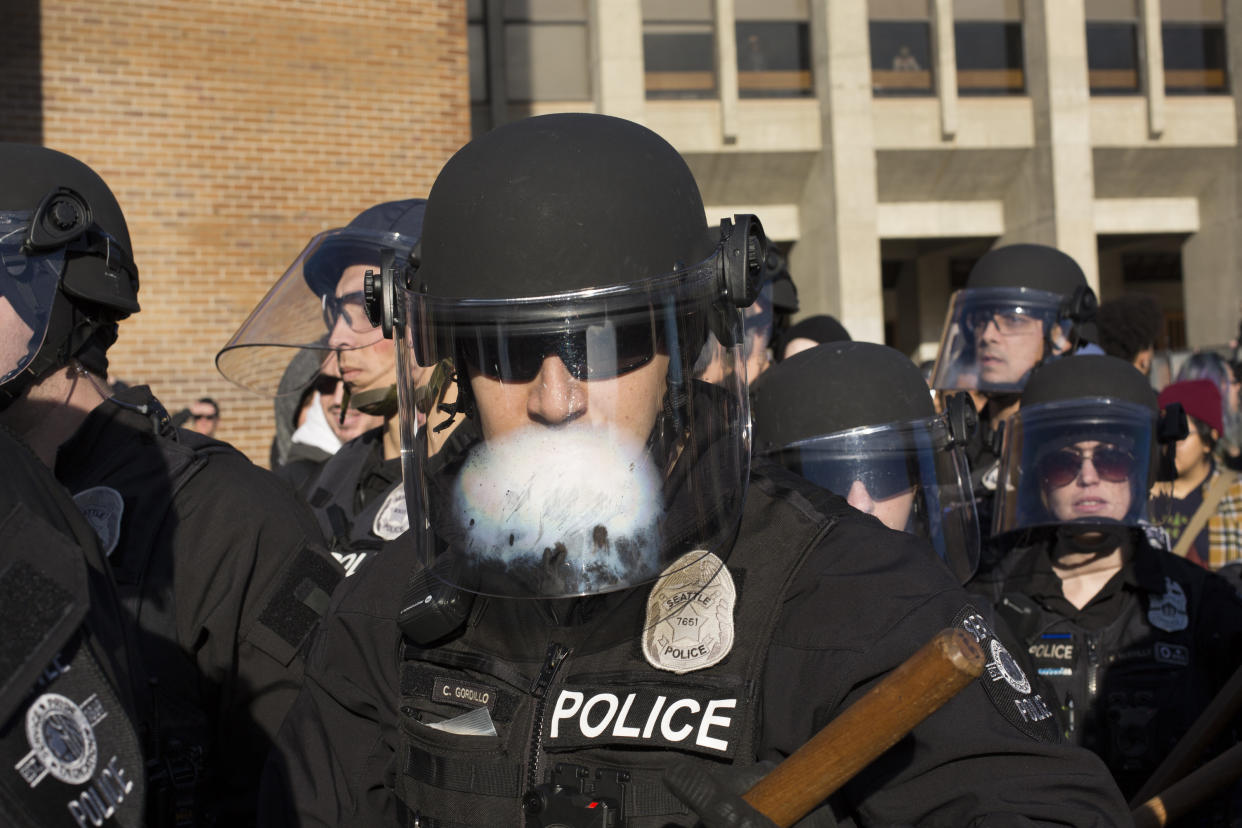 Seattle police move on counterprotesters Saturday at Red Square at the University of Washington. (Photo: Getty/David Ryder)