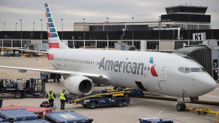 Workers load luggage onto an American Airlines aircraft at O’Hare International Airport in Chicago, Illinois. American Airlines recently made history with an all-Black female crew for the first time in the carrier’s 96 years. (Photo: Scott Olson/Getty Images)