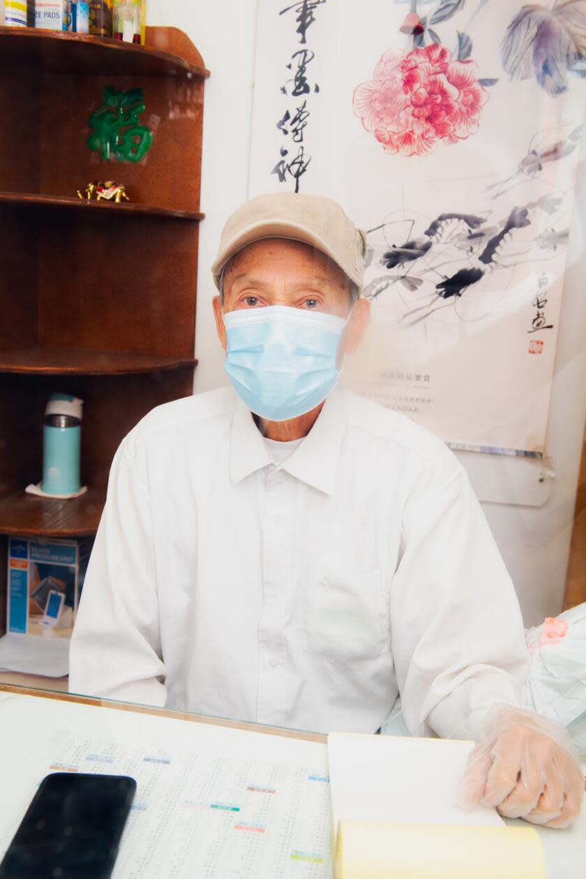 Portrait of Huang inside the clinic.