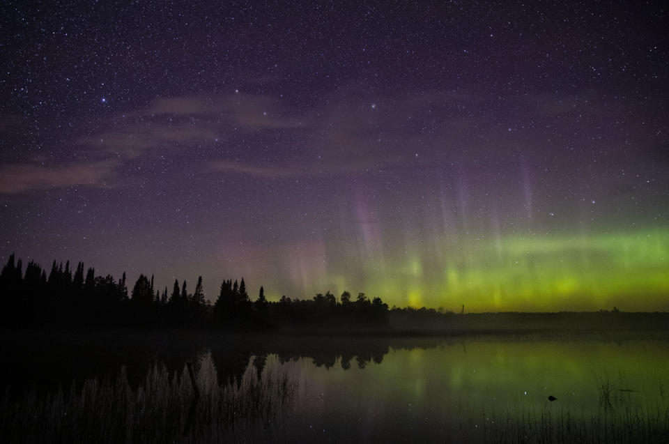 The aurora borealis could be seen on the North horizon in the night sky over Wolf Lake in the Cloquet State Forest in Minnesota around midnight on Saturday morning. The KP index was high in the early morning hours of Saturday Sept. 28, 2019, which meant the aurora borealis was visible from northern Minnesota. / Credit: Alex Kormann/Star Tribune via Getty Images