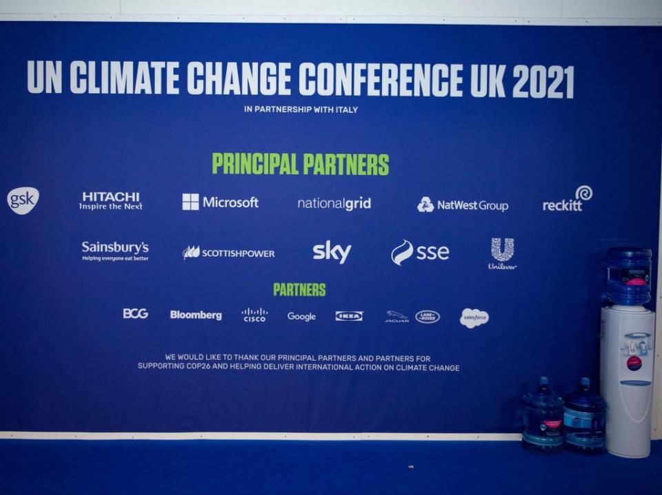 The sponsors’ names emblazoned across the Cop26 venue’s wall (Alamy Live News)