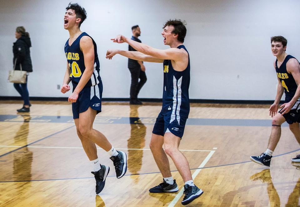 Delta celebrates the final seconds its county title win against Wapahani during their championship game at Delta High School Saturday, Jan. 15, 2022.