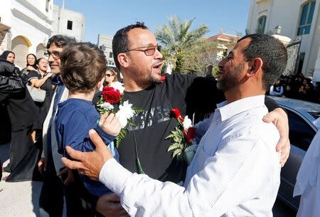 Ali Al-Ekri (C) hugs his family member as he is welcomed home after completing his five-year sentence, in Manama, Bahrain March 10, 2017. REUTERS/Hamad I Mohammed