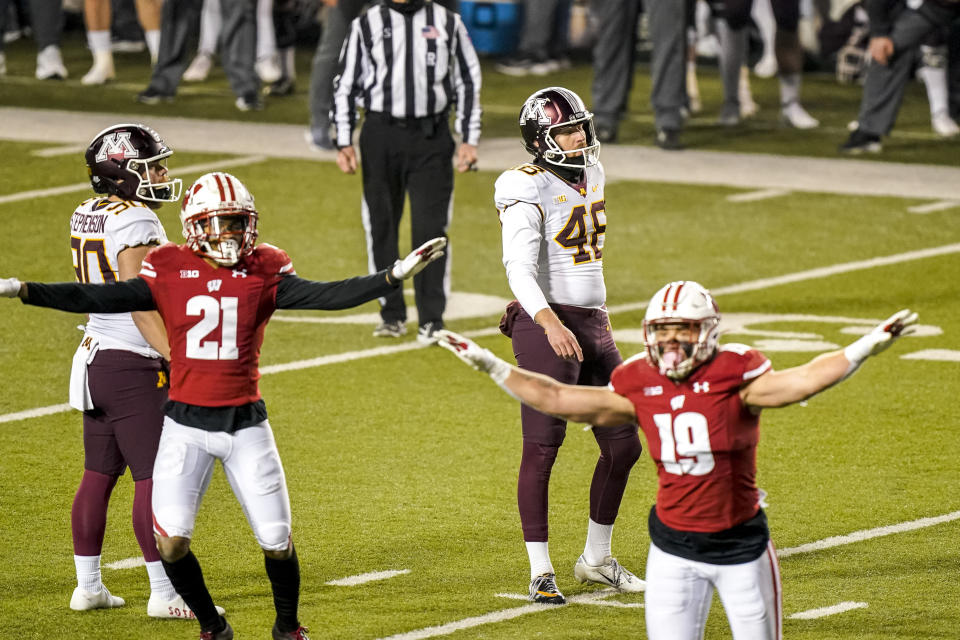 Minnesota kicker Andres Gelecinskyj (48) reacts after his field goal attempt failed during overtime of an NCAA college football game against Wisconsin, Saturday, Dec. 19, 2020, in Madison, Wis. (AP Photo/Andy Manis)