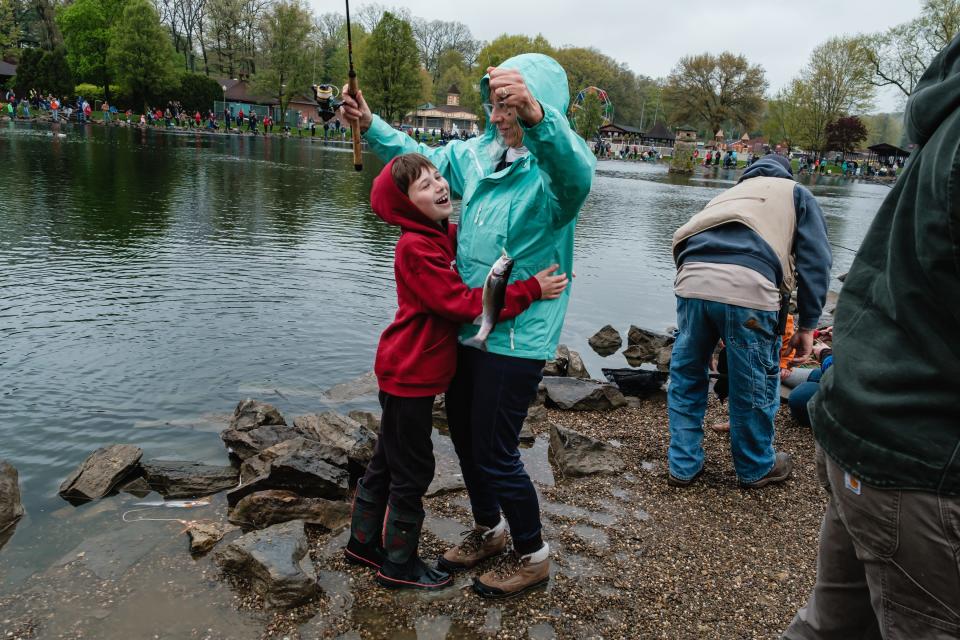 Roscoe Bishop, 8, of Dover, exclaims, "You're the best grandma," as he embraces his grandmother, Patty Bishop, after catching a rainbow trout during the inaugural trout derby last weekend at the Tuscora Park Pond in New Philadelphia.