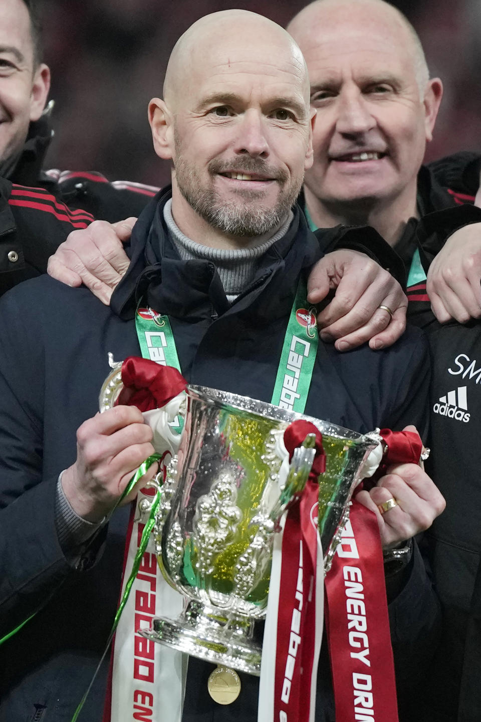 Manchester United's head coach Erik ten Hag poses with the trophy after the English League Cup final soccer match between Manchester United and Newcastle United at Wembley Stadium in London, Sunday, Feb. 26, 2023. (AP Photo/Alastair Grant)