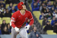 Los Angeles Angels' Shohei Ohtani runs to first as he flies out during the sixth inning of a preseason baseball game against the Los Angeles Dodgers Sunday, March 26, 2023, in Los Angeles. (AP Photo/Mark J. Terrill)