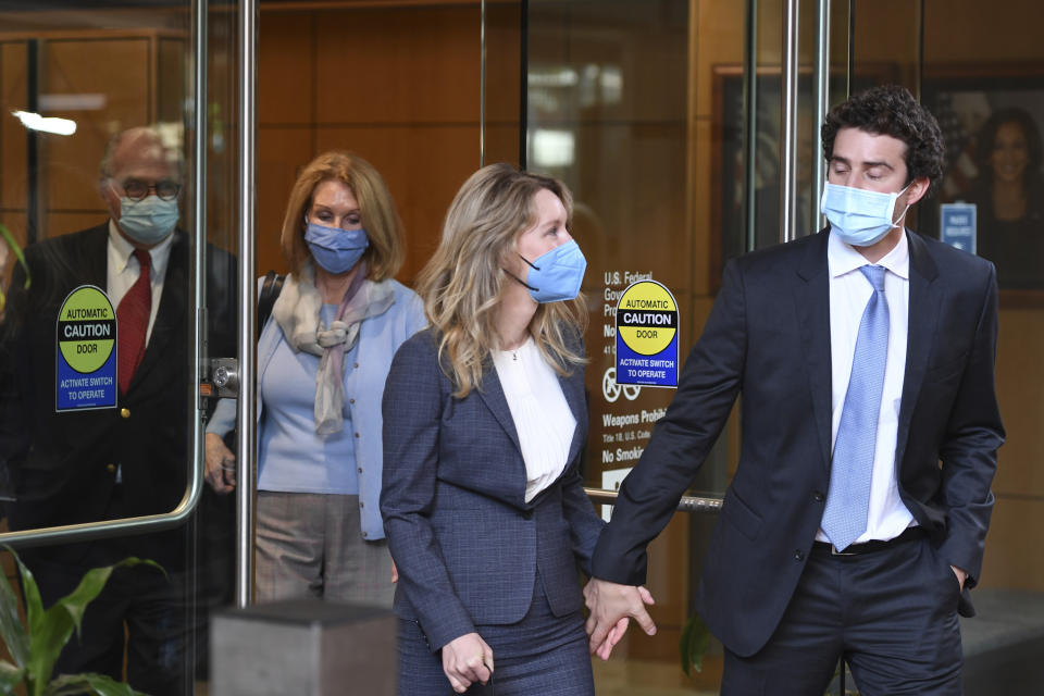 Elizabeth Holmes leaves the United States Federal Courthouse in San Jose, Calif., Wednesday, Sept. 8, 2021. Her company Theranos failed in 2018, a few years after a series of explosive stories in The Wall Street Journal exposed serious flaws in its technology and spurred regulatory investigations that shut down the testing. (AP Photo/Nic Coury)