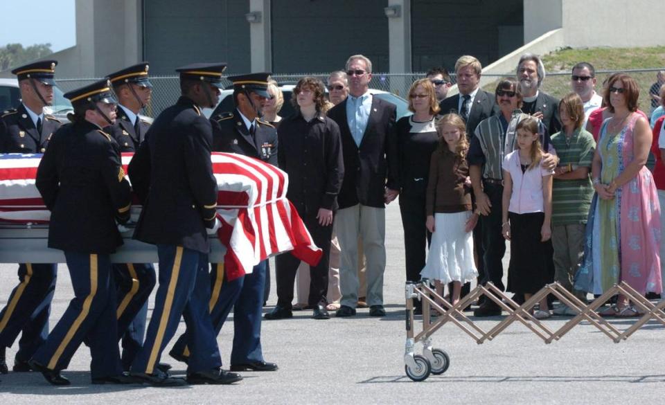 Members of the Florida National Guard Military Honors Squad from St. Petersburg, carry the body of Army Pfc. Christopher North to were his family is waiting, after arriving at the Sarasota Bradenton International Airport on Friday, April 27, 2007. North, 21, a Lakewood Ranch High School graduate, was killed in Iraq by an improvised explosive devise.