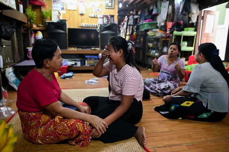 Family members of Sithu, 37, who was killed during a raid by security forces mourn at their home in Thaketa, Yangon