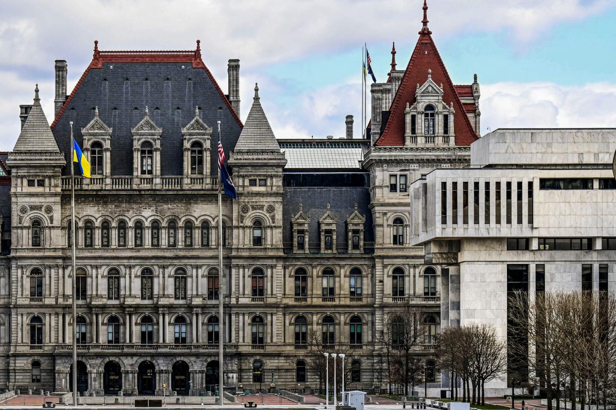 A partial view of the New York State Capitol building (left) is shown next to the state Appellate court building in the foreground (right) in Albany, New York on April 4, 2022.