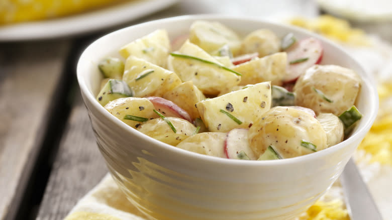 Bowl of potato salad with onions