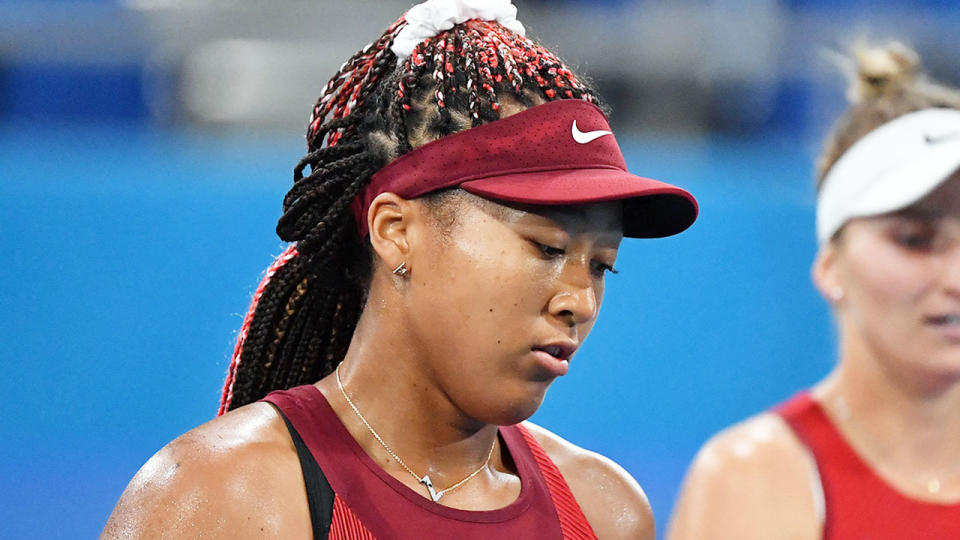 Pictured here, Naomi Osaka looks shattered after a shock straight sets loss at the Olympics.