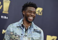 FILE - In this Saturday, June 16, 2018 file photo, Chadwick Boseman arrives at the MTV Movie and TV Awards at the Barker Hangar in Santa Monica, Calif. Actor Chadwick Boseman, who played Black icons Jackie Robinson and James Brown before finding fame as the regal Black Panther in the Marvel cinematic universe, has died of cancer. His representative says Boseman died Friday, Aug. 28, 2020 in Los Angeles after a four-year battle with colon cancer. He was 43. (Photo by Jordan Strauss/Invision/AP, File)