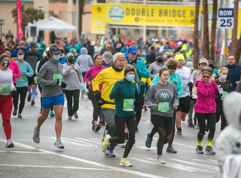 Runners take to the streets during a past Double Bridge Run at Pensacola Beach. This year's run takes place on Saturday.