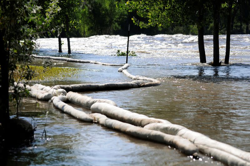 FILE PHOTO: Absorbent boom is placed after an oil spill along the Yellowstone River in Laurel Montana