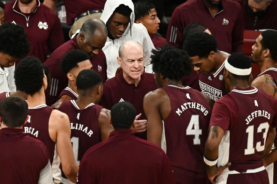 Jan 22, 2022; Starkville, Mississippi, USA; Mississippi State Bulldogs head coach Ben Howland speaks with players during a timeout during the first half of the game against the Mississippi Rebels at Humphrey Coliseum. Mandatory Credit: Matt Bush-USA TODAY Sports