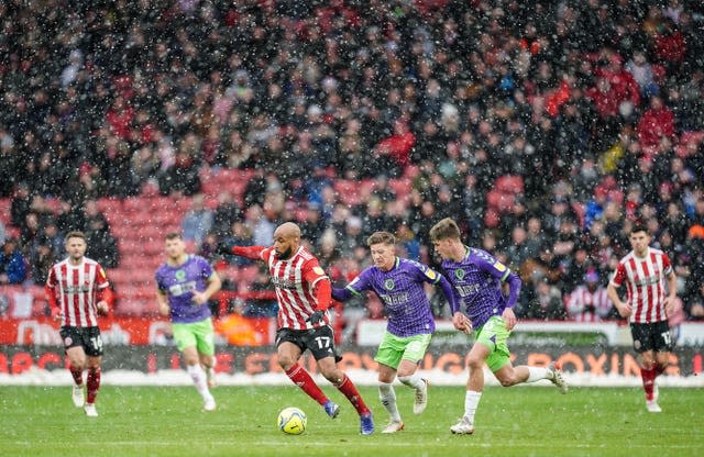 David McGoldrick, centre left, shields possession as Sheffield United take on Bristol City