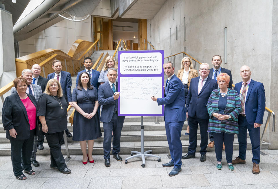 Liam McArthur, centre right, will publish legislation on Thursday that aims to introduce assisted dying for terminally ill people in Scotland (Jane Barlow/PA)