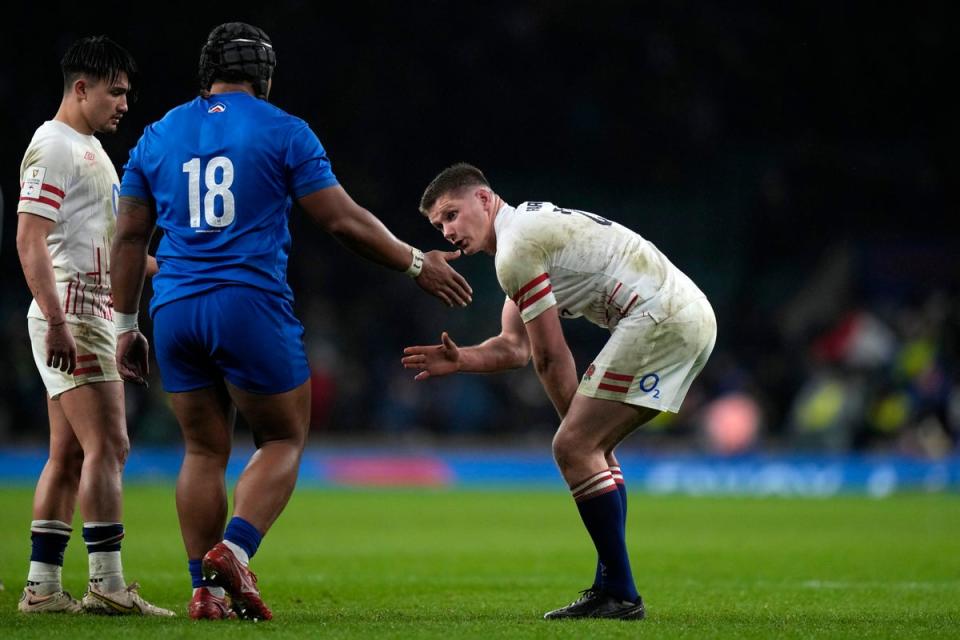 Owen Farrell is commiserated by Sipili Falatea (AP)