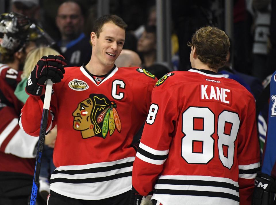 Chicago Blackhawks' Jonathan Toews, left, talk with teammate Patrick Kane during the NHL All-Star Skills Competition, Saturday, Jan. 28, 2017, in Los Angeles, the day before the All-Star Game. (AP Photo/Mark J. Terrill)