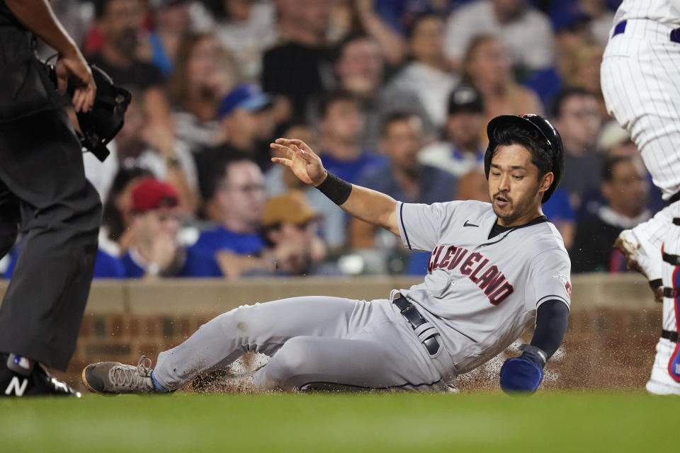 Cleveland Guardians' Steven Kwan scores on Amed Rosario's two-run single against the Chicago Cubs during the third inning of a baseball game Saturday, July 1, 2023, in Chicago. (AP Photo/Charles Rex Arbogast)