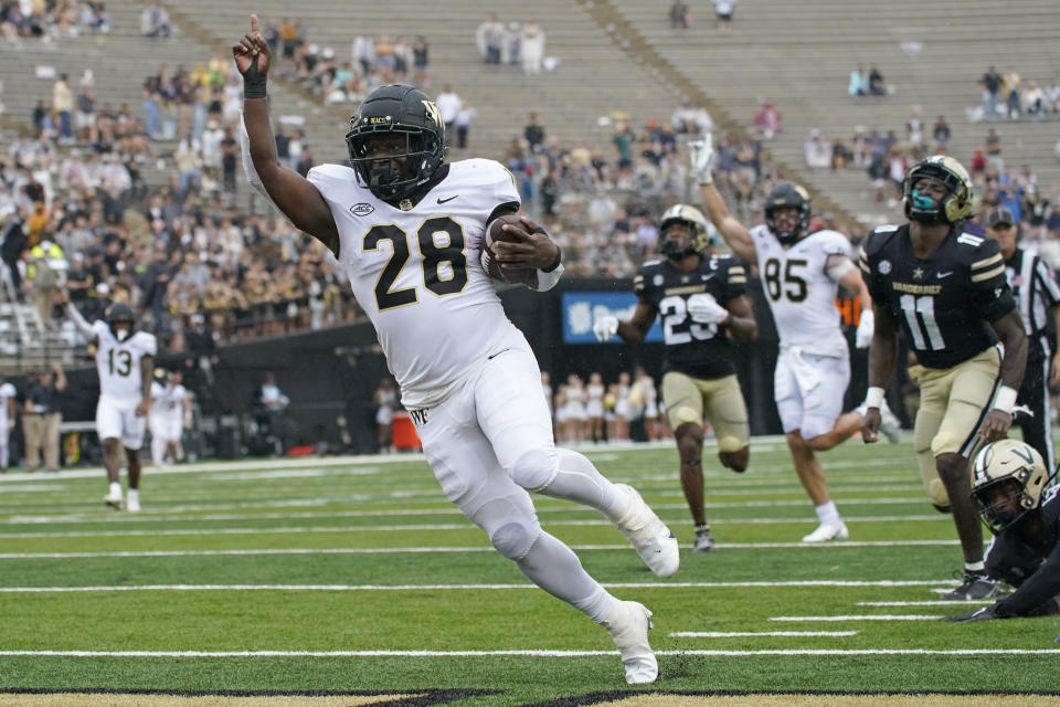 Wake Forest running back Quinton Cooley (28) scores a touchdown on a 24-yard run against Vanderbilt in the second half of an NCAA college football game Saturday, Sept. 10, 2022, in Nashville, Tenn. Wake Forest won 45-25. (AP Photo/Mark Humphrey)