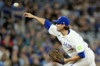 Toronto Blue Jays pitcher Kevin Gausman works against the Colorado Rockies during first-inning baseball game action in Toronto, Friday, April 12, 2024. (Frank Gunn/The Canadian Press via AP)