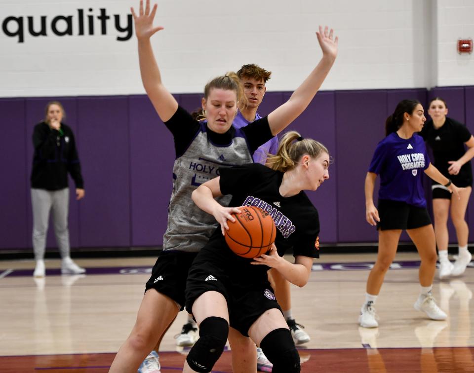 WORCESTER - Sophomore forward Meg Cahalan tries to block Senior Bronagh Power-Cassidy during Holy Cross women's head basketball practice.