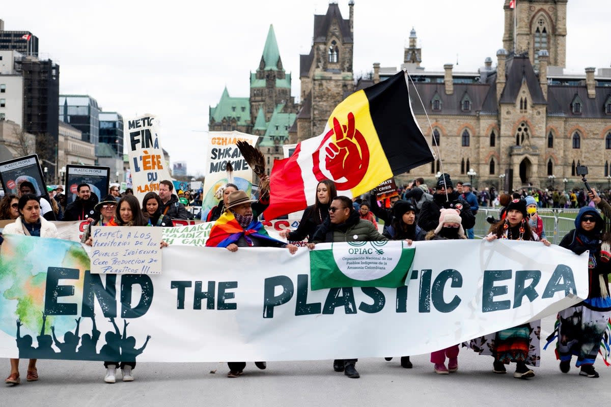 People participate in a March to End the Plastic Era on Parliament Hill in Ottawa, Ontario (The Canadian Press)