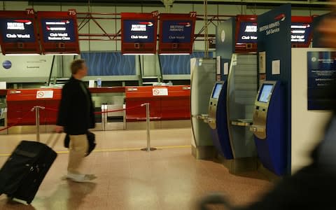 BA check in desks - Credit: AP Photo/Alastair Grant