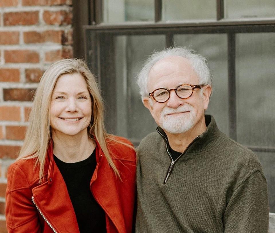 Phil Herring, standing next to his wife, Kim, is a small business owner in Bainbridge Island, Washington, who sells Koi fish. He is concerned that a government default would hit his business "fast and hard."