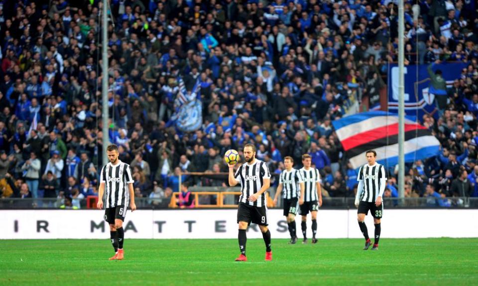 The Juventus players look dejected as Sampdoria’s fans celebrate the opening goal, but things quickly got worse for the champions.