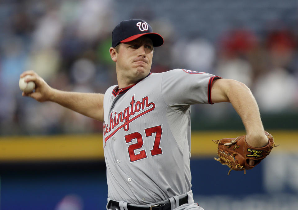 FILE - Then-Washington Nationals starting pitcher Jordan Zimmermann throws to an Atlanta Braves batter in the first inning of a baseball game in Atlanta, in this Wednesday, May 1, 2013, file photo. Milwaukee Brewers pitcher Jordan Zimmermann has retired, ending a career in which he earned two All-Star Game selections and threw the first no-hitter in Washington Nationals history. The Brewers announced Zimmermann’s retirement Tuesday, May 11, 2021.(AP Photo/John Bazemore, File)