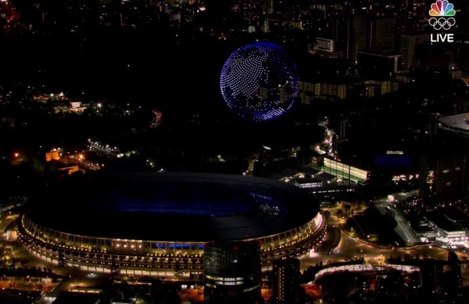 Drones form the Earth above the Olympic Stadium.