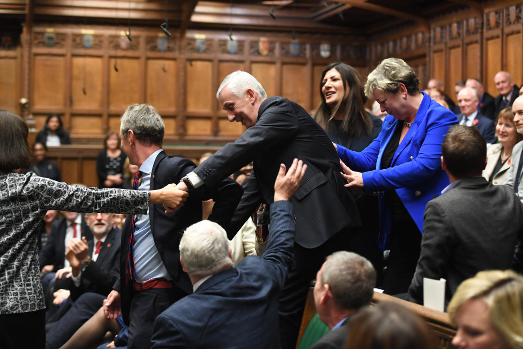 Lindsay Hoyle (centre) being dragged to the speaker's chair after becoming the new Speaker of the House of Commons in 2019. (PA)
