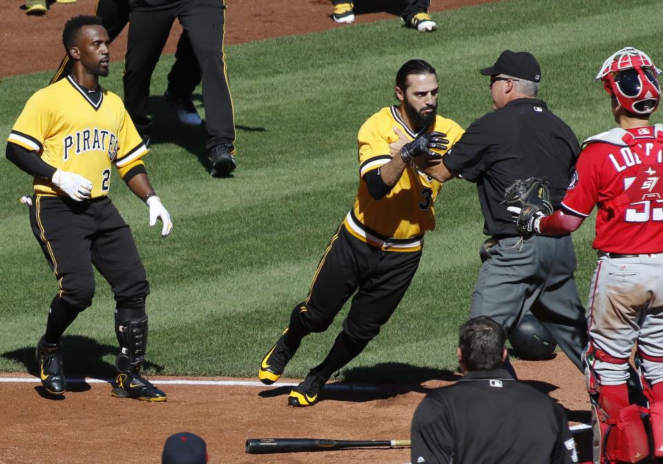 <p>Sean Rodriguez #3 of the Pittsburgh Pirates is held back by third base umpire Mike Everitt during a bench clearing altercation against the Washington Nationals at PNC Park on September 25, 2016 in Pittsburgh, Pennsylvania. (Photo by Justin K. Aller/Getty Images) </p>