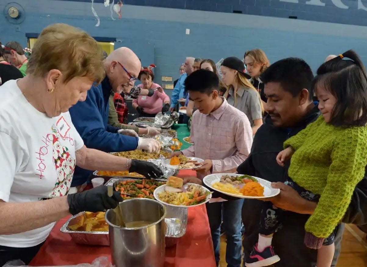 Volunteers serve meals at the 2019 Bounty of Bethlehem.