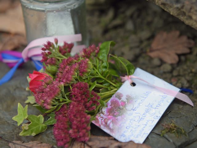 Floral tributes at the scene (Ben Birchall/PA)