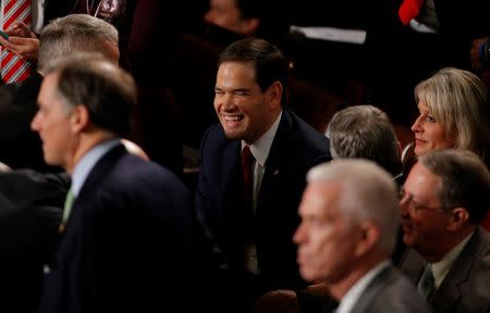 U.S. Republican presidential candidate Senator Marco Rubio (C) waits on the floor of the House of Representatives before the start of U.S. President Barack Obama's State of the Union address to a joint session of Congress in Washington, January 12, 2016. REUTERS/Carlos Barria