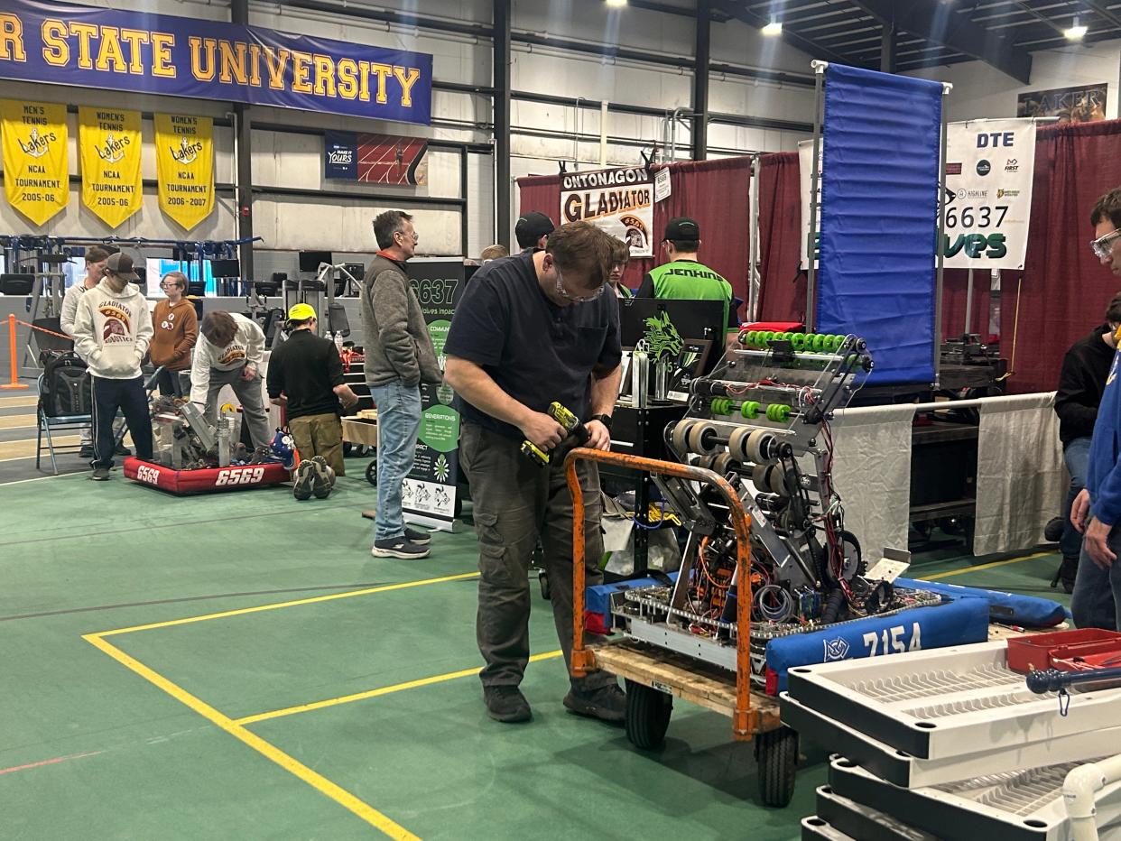 Teams work on last minute changes to their robots during the FIRST Robotics competition hosted by LSSU on March 14, 2024.